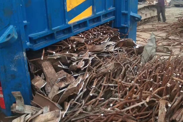What are some common applications for heavy metal scrap shear machines in the metal recycling industry?